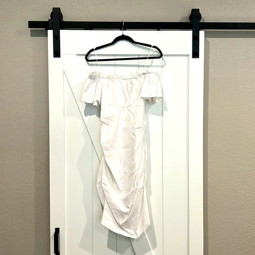 White off the shoulder ARTELIER touched body con dress. SIZE 6.